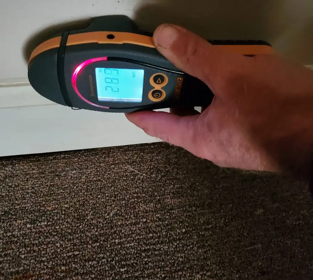 Moisture detection at baseboard during Storm Damage Restoration in Gillette